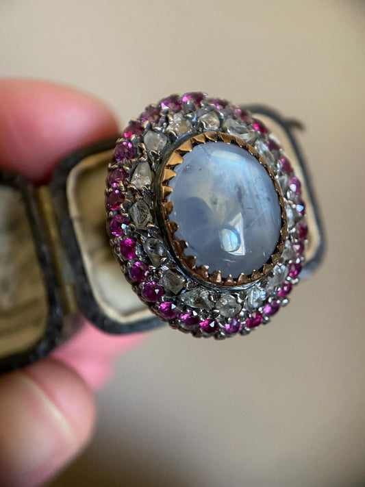 Antique Star Sapphire Cluster Ring with Double Halos of Ruby Pastes and Diamond Chips with Pierced Floral Verso in Silver and 18k Gold, Georgian, Victorian